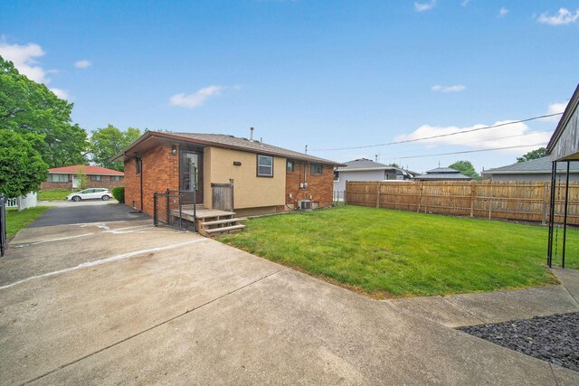 1345 Molly Ln, Columbus, OH 43207 - rear view of house featuring brick siding