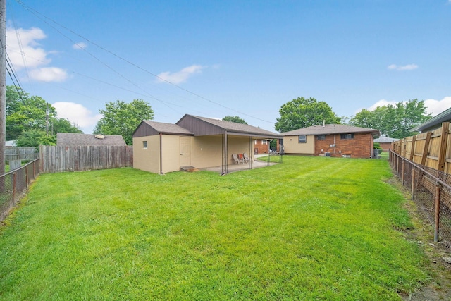 1345 Molly Ln, Columbus, OH 43207 - fenced backyard featuring a patio area