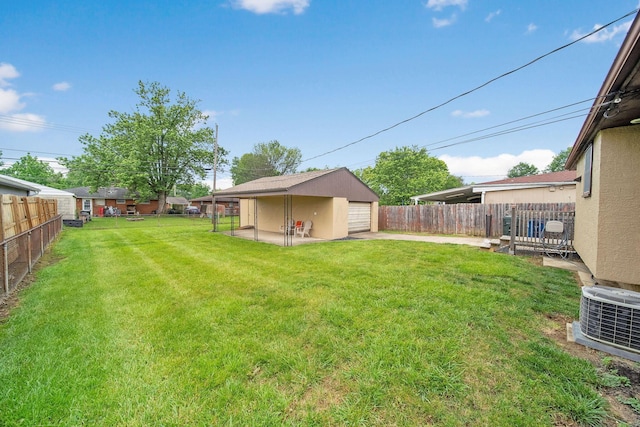 1345 Molly Ln, Columbus, OH 43207 - fenced backyard featuring a garage and concrete driveway