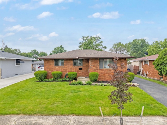1345 Molly Ln, Columbus, OH 43207 - view of front facade featuring brick siding and driveway