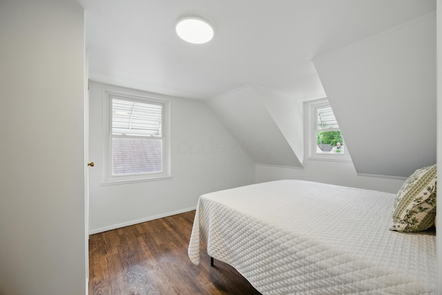 2770 Columbus Ave, Bexley, OH 43209 - bedroom with multiple windows, wood finished floors, vaulted ceiling, and baseboards