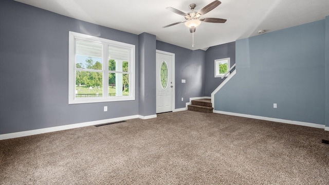 422 N Cedar St, Newark, OH 43055 - spare room with ceiling fan, carpet flooring, stairway, and baseboards