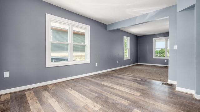 422 N Cedar St, Newark, OH 43055 - unfurnished room featuring baseboards, wood finished floors, and beam ceiling