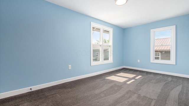 422 N Cedar St, Newark, OH 43055 - unfurnished room featuring dark carpet and baseboards