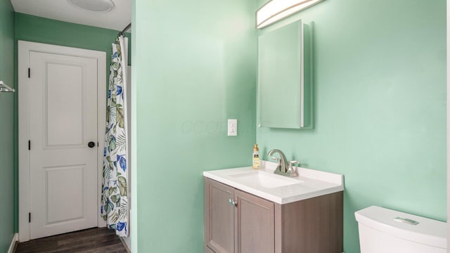 422 N Cedar St, Newark, OH 43055 - bathroom with vanity, toilet, wood finished floors, and a shower with curtain