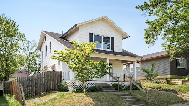 422 N Cedar St, Newark, OH 43055 - view of front facade with a porch and a shingled roof