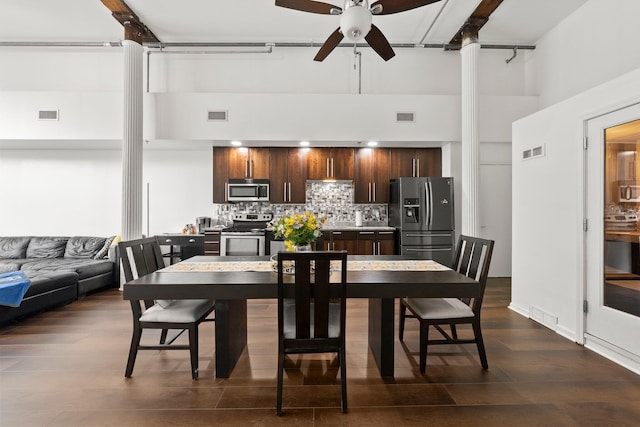 78 E Chestnut St Unit 107, Columbus, OH 43215 - dining room with a high ceiling, ceiling fan, dark wood finished floors, and decorative columns