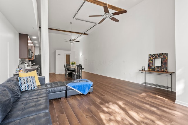 78 E Chestnut St Unit 107, Columbus, OH 43215 - living area featuring ceiling fan, high vaulted ceiling, wood finished floors, and baseboards