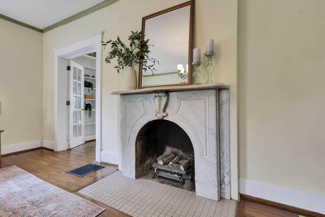 78 Griswold St, Delaware, OH 43015 - detailed view of wood finished floors, crown molding, baseboards, and a premium fireplace