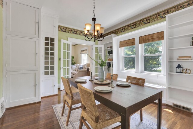 78 Griswold St, Delaware, OH 43015 - dining room with a chandelier, dark wood-style floors, and built in features