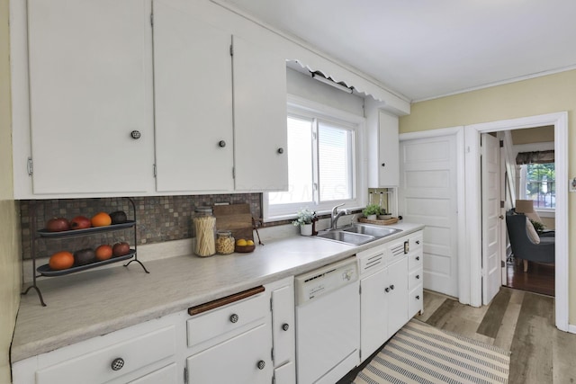78 Griswold St, Delaware, OH 43015 - kitchen with white dishwasher, a sink, white cabinets, and light countertops