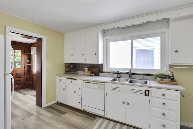 78 Griswold St, Delaware, OH 43015 - kitchen featuring white appliances, a sink, light wood-style flooring, light countertops, and white cabinetry