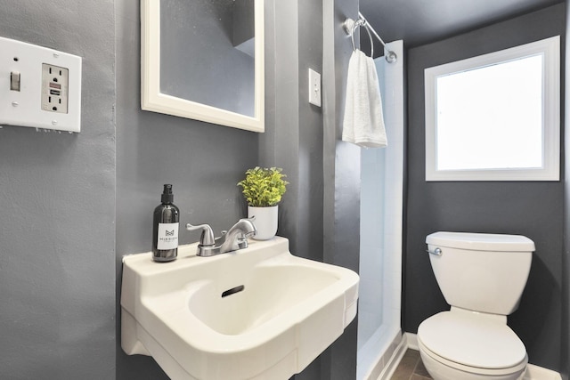 78 Griswold St, Delaware, OH 43015 - bathroom featuring a sink, toilet, and baseboards
