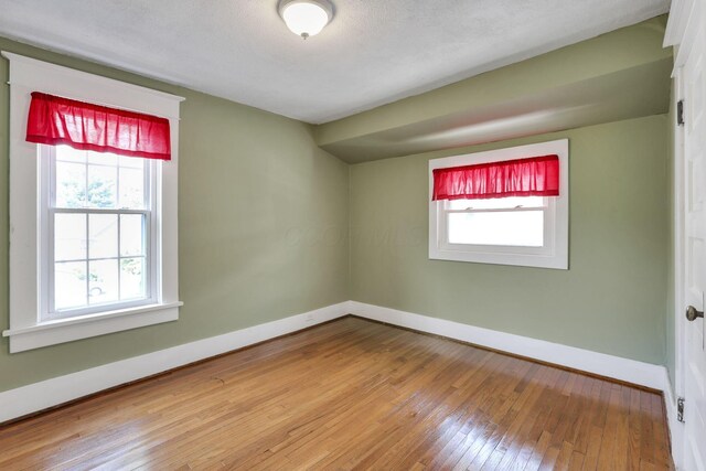 78 Griswold St, Delaware, OH 43015 - spare room with plenty of natural light, baseboards, and wood-type flooring