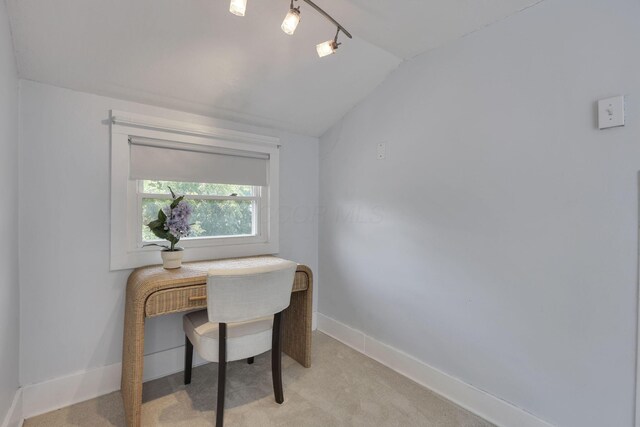 78 Griswold St, Delaware, OH 43015 - home office with vaulted ceiling, light colored carpet, rail lighting, and baseboards