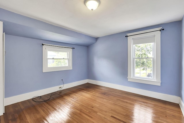 78 Griswold St, Delaware, OH 43015 - empty room with plenty of natural light, baseboards, and hardwood / wood-style floors