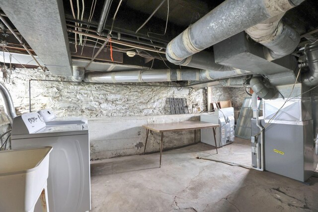 78 Griswold St, Delaware, OH 43015 - unfinished basement with independent washer and dryer, a sink, and heating unit