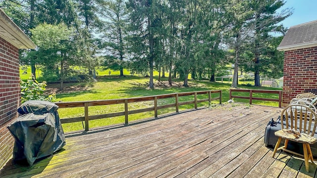 949 Mohican Ave, Logan, OH 43138 - wooden deck with a lawn, view of wooded area, and grilling area