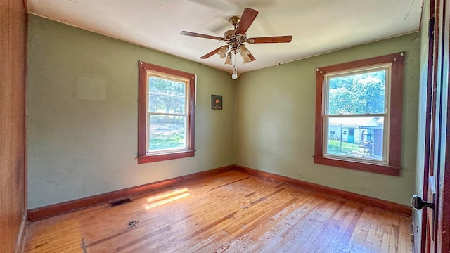 949 Mohican Ave, Logan, OH 43138 - unfurnished room with plenty of natural light, light wood-type flooring, baseboards, and ceiling fan