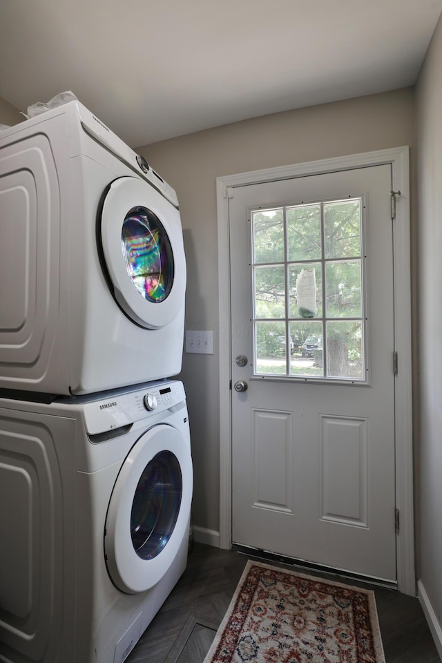1208 Seymour Ave, Columbus, OH 43206 - laundry room featuring stacked washer / dryer and baseboards