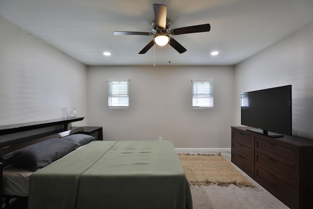 1208 Seymour Ave, Columbus, OH 43206 - bedroom featuring multiple windows, carpet, baseboards, ceiling fan, and recessed lighting