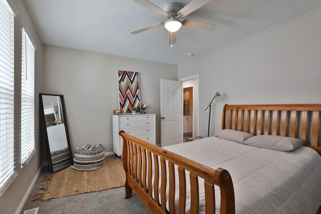 1208 Seymour Ave, Columbus, OH 43206 - bedroom featuring carpet flooring, multiple windows, baseboards, and a ceiling fan