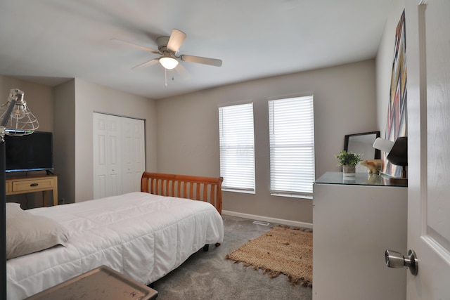 1208 Seymour Ave, Columbus, OH 43206 - carpeted bedroom with baseboards, a ceiling fan, and a closet