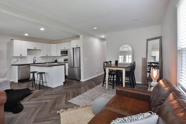 1208 Seymour Ave, Columbus, OH 43206 - living room featuring healthy amount of natural light, baseboards, and recessed lighting