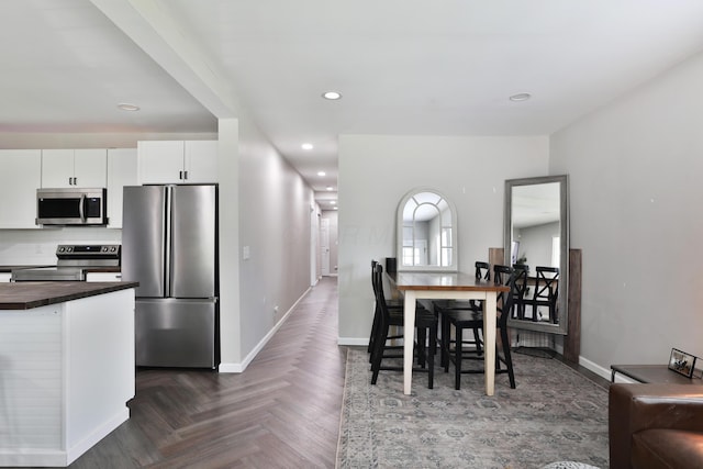 1208 Seymour Ave, Columbus, OH 43206 - dining space with baseboards and recessed lighting