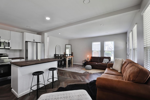 1208 Seymour Ave, Columbus, OH 43206 - living room with baseboards and recessed lighting