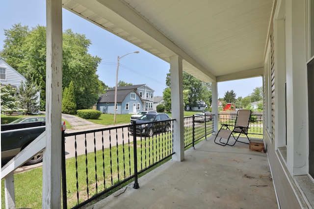 1208 Seymour Ave, Columbus, OH 43206 - covered porch featuring a residential view and a lawn