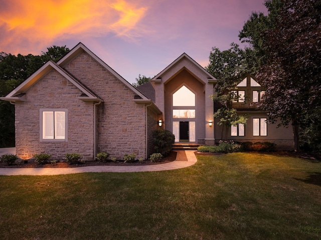 1488 Brittingham Ln, Powell, OH 43065 - view of front of home with stone siding and a lawn