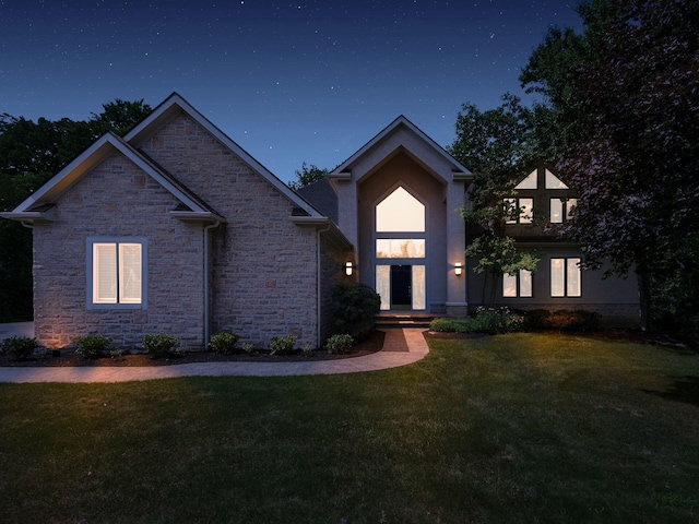 1488 Brittingham Ln, Powell, OH 43065 - view of front of house with stone siding and a front yard