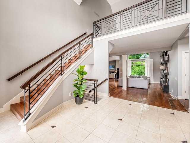 1488 Brittingham Ln, Powell, OH 43065 - staircase featuring tile patterned flooring and baseboards
