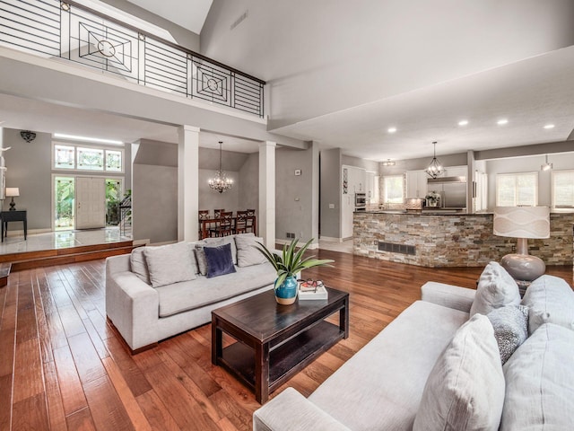 1488 Brittingham Ln, Powell, OH 43065 - living room featuring a chandelier, hardwood / wood-style floors, and recessed lighting