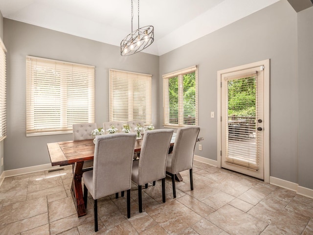 1488 Brittingham Ln, Powell, OH 43065 - dining space featuring stone tile flooring and lofted ceiling