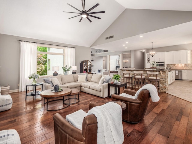 1488 Brittingham Ln, Powell, OH 43065 - living room with light wood-type flooring, high vaulted ceiling, a chandelier, a ceiling fan, and recessed lighting