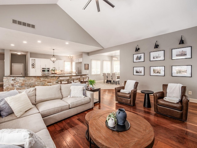 1488 Brittingham Ln, Powell, OH 43065 - living area with a chandelier, dark wood-style flooring, high vaulted ceiling, recessed lighting, and ceiling fan