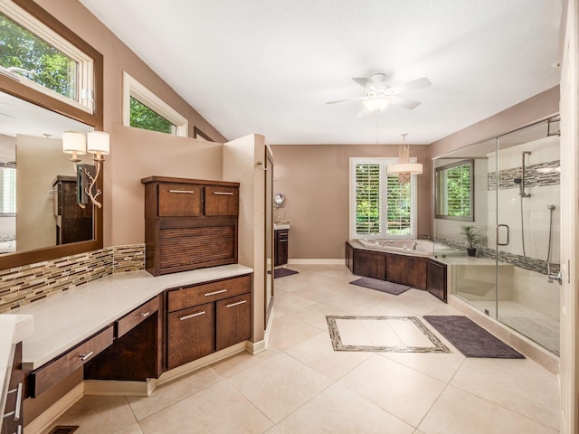 1488 Brittingham Ln, Powell, OH 43065 - bathroom featuring a garden tub, ceiling fan, decorative backsplash, a stall shower, and tile patterned flooring