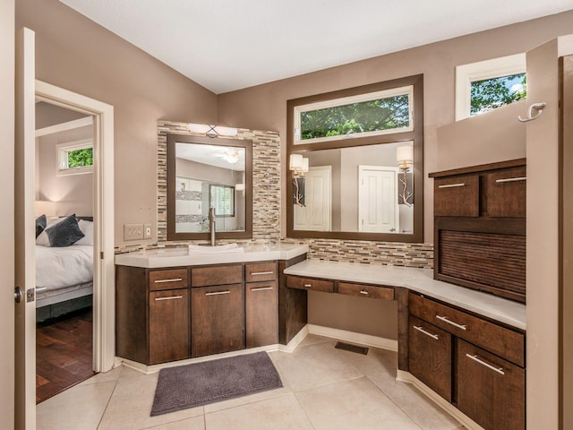 1488 Brittingham Ln, Powell, OH 43065 - ensuite bathroom featuring tasteful backsplash, vanity, and tile patterned floors