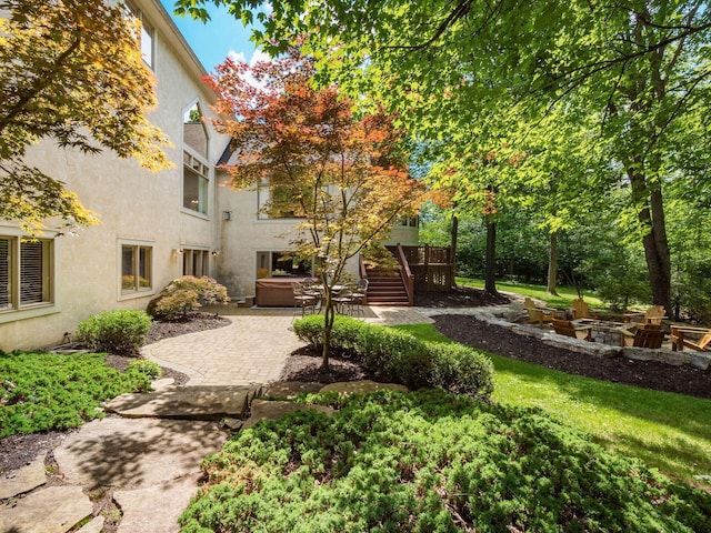 1488 Brittingham Ln, Powell, OH 43065 - view of yard featuring a hot tub, a patio, and stairway