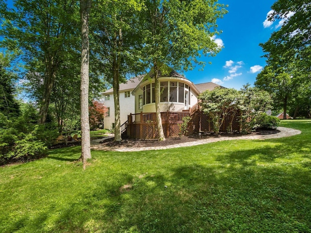 1488 Brittingham Ln, Powell, OH 43065 - rear view of house with a yard, stucco siding, and a sunroom