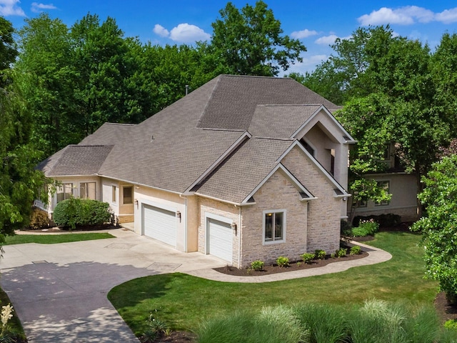 1488 Brittingham Ln, Powell, OH 43065 - craftsman-style house featuring driveway, a shingled roof, a front lawn, an attached garage, and stone siding