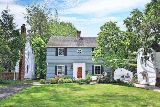 155 Aldrich Rd, Columbus, OH 43214 - colonial-style house with a front lawn and a chimney
