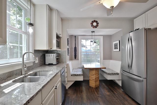 155 Aldrich Rd, Columbus, OH 43214 - kitchen featuring stainless steel appliances, dark wood-type flooring, breakfast area, light stone counters, and white cabinetry