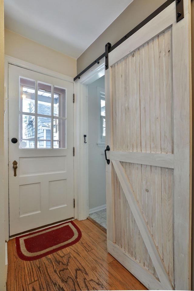 155 Aldrich Rd, Columbus, OH 43214 - doorway to outside featuring a barn door and wood finished floors