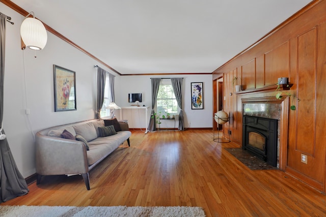 155 Aldrich Rd, Columbus, OH 43214 - living room with light wood-type flooring, ornamental molding, and a fireplace with flush hearth