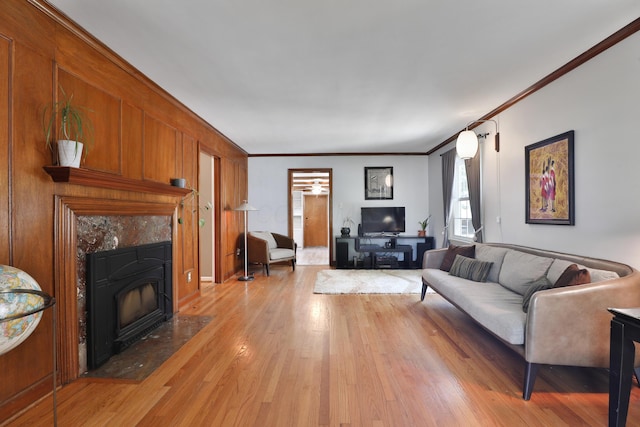 155 Aldrich Rd, Columbus, OH 43214 - living area with light wood-style flooring, ornamental molding, and a fireplace