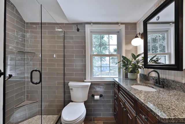 155 Aldrich Rd, Columbus, OH 43214 - full bath featuring vanity, a shower stall, and tile walls