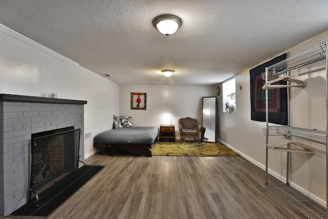 155 Aldrich Rd, Columbus, OH 43214 - sitting room with wood finished floors, a textured ceiling, and a fireplace